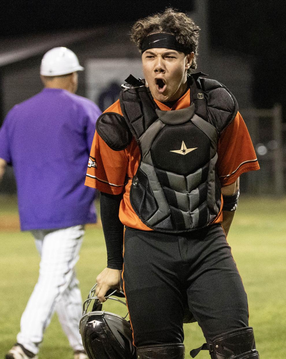 Aiden Simmons celebrating behind the plate after a play
